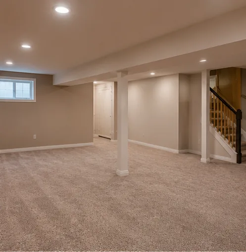 Finished carpeted basement rec room with recessed lighting